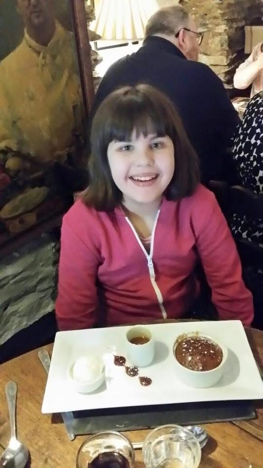 Lillie enjoying her favourite pudding, chocolate cake